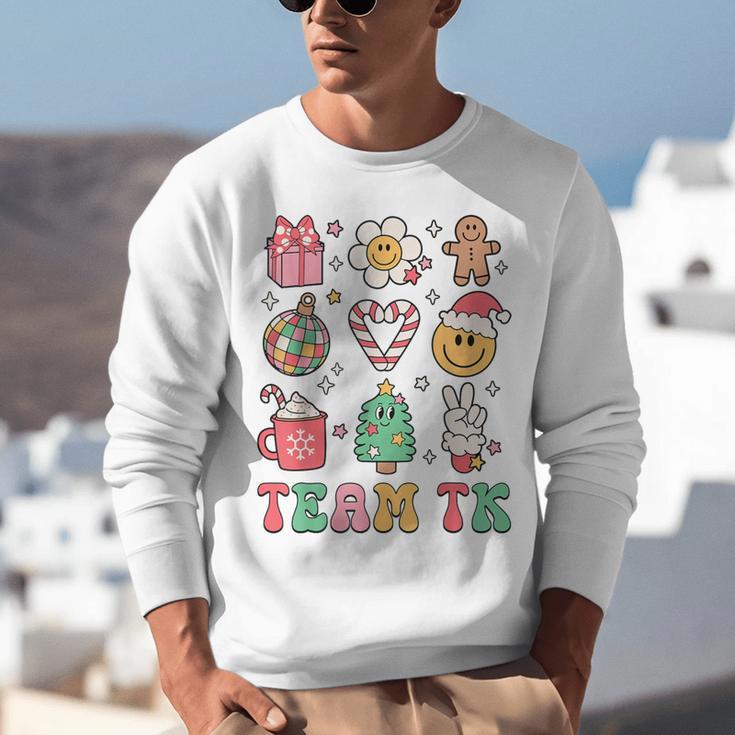 Team TK Teacher Christmas Groovy Smile Face Girl Boy Kid TK Unisex Sweatshirt, Groovy Teacher Sweatshirts, funny gift Team TK Teacher Christmas Groovy Smile Face Girl Boy Kid TK Unisex Sweatshirt, Groovy Teacher Sweatshirts, funny gift