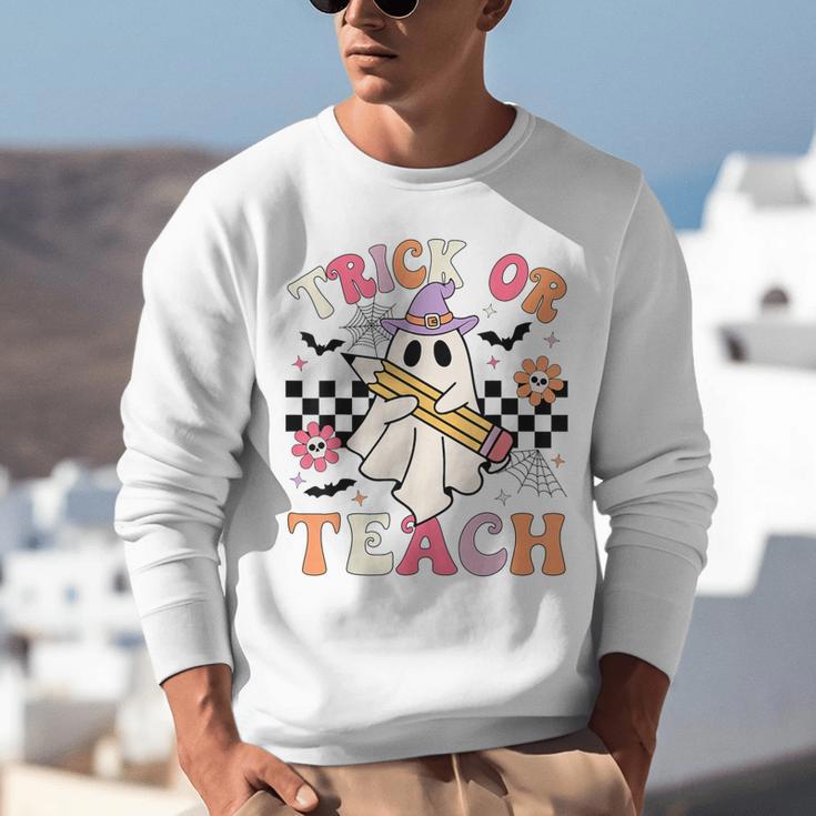 Trick Or Teach Groovy Teacher Halloween Retro Floral Ghost Unisex Sweatshirt, Groovy Teacher Sweatshirts, funny gift Trick Or Teach Groovy Teacher Halloween Retro Floral Ghost Unisex Sweatshirt, Groovy Teacher Sweatshirts, funny gift