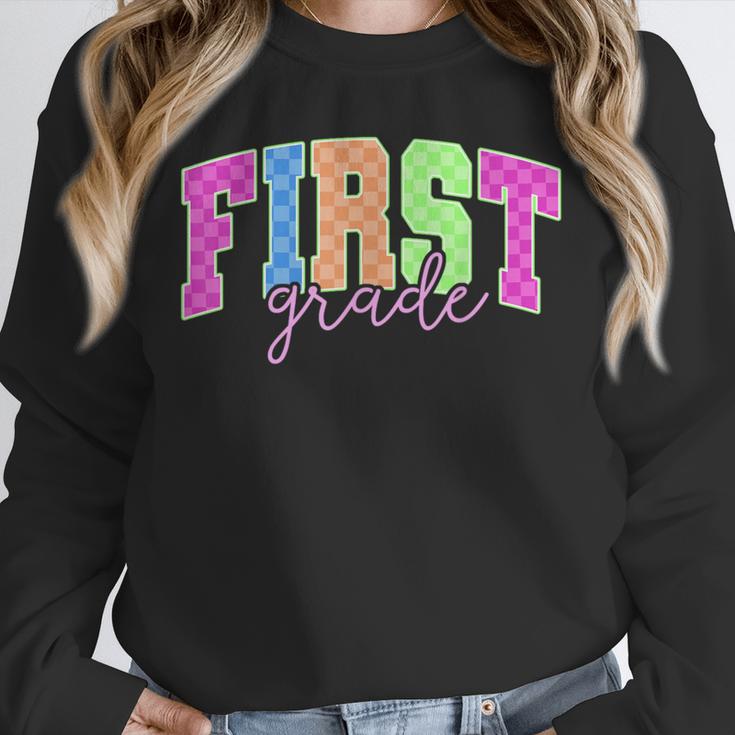 Back To School Neon Checkered First Grade Colorful Teacher Unisex Sweatshirt, novelty gifts, funny gifts Back To School Neon Checkered First Grade Colorful Teacher Unisex Sweatshirt, novelty gifts, funny gifts