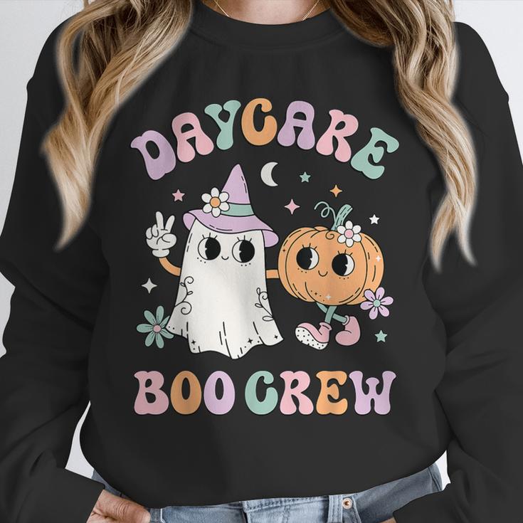 Daycare Boo Crew Groovy Halloween Floral Ghost Kid Teacher Unisex Sweatshirt, novelty gifts, funny gifts