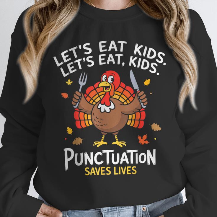 Lets Eat Kids Punctuation Saves Lives Thanksgiving Teacher Unisex Sweatshirt, novelty gifts, funny gifts Lets Eat Kids Punctuation Saves Lives Thanksgiving Teacher Unisex Sweatshirt, novelty gifts, funny gifts