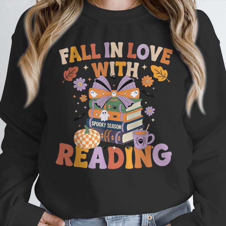 Fall In Love With Reading Halloween Stack Of Book Teacher Unisex Sweatshirt, novelty gifts, funny gifts Fall In Love With Reading Halloween Stack Of Book Teacher Unisex Sweatshirt, novelty gifts, funny gifts