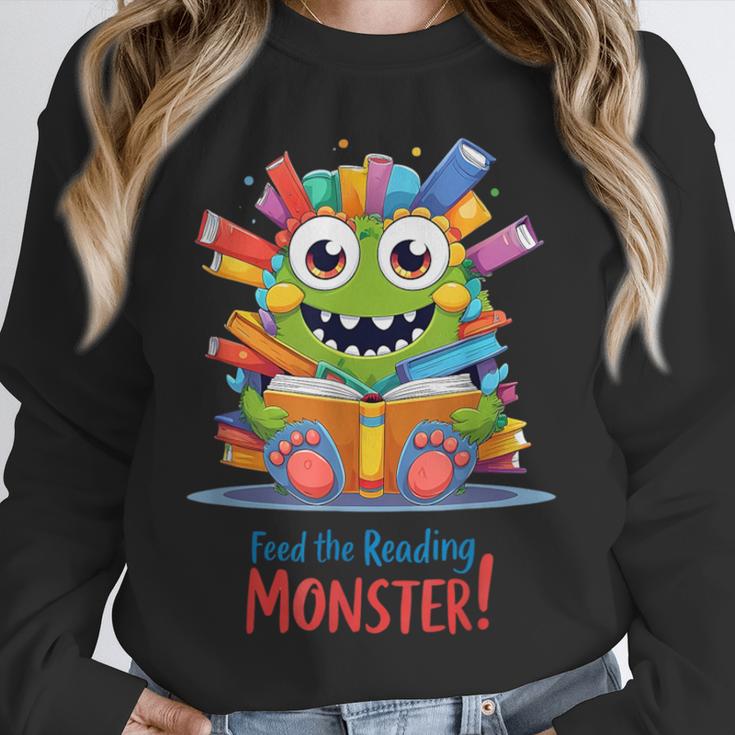 Feed The Reading Monster Halloween Teacher Unisex Sweatshirt, novelty gifts, funny gifts Feed The Reading Monster Halloween Teacher Unisex Sweatshirt, novelty gifts, funny gifts
