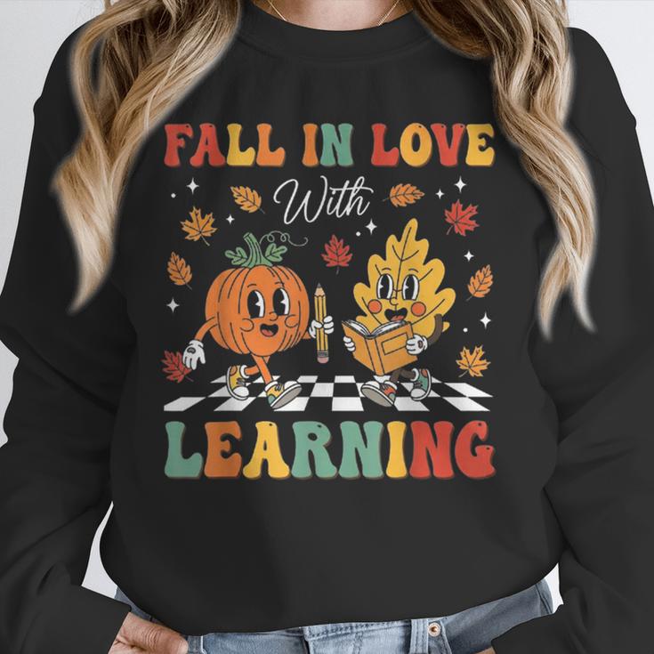 Groovy Fall In Love With Learning Autumn Pumpkin Teacher Unisex Sweatshirt, novelty gifts, funny gifts Groovy Fall In Love With Learning Autumn Pumpkin Teacher Unisex Sweatshirt, novelty gifts, funny gifts