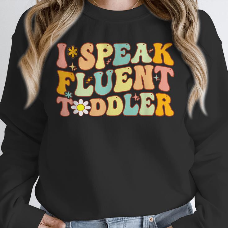 Groovy I Speak Fluent Toddler Daycare Provider Teacher Unisex Sweatshirt, novelty gifts, funny gifts Groovy I Speak Fluent Toddler Daycare Provider Teacher Unisex Sweatshirt, novelty gifts, funny gifts