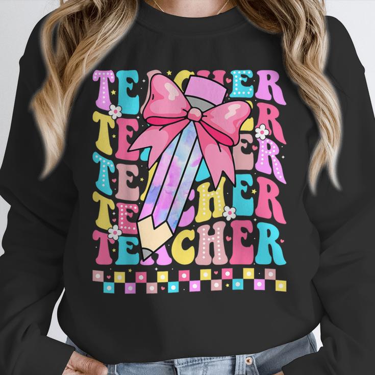Groovy Teacher Cute Coquette Bow Flower Retro Back To School Unisex Sweatshirt, novelty gifts, funny gifts Groovy Teacher Cute Coquette Bow Flower Retro Back To School Unisex Sweatshirt, novelty gifts, funny gifts