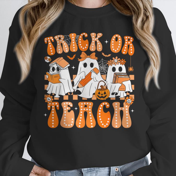 Groovy Teacher Halloween Trick Or Teach Ghost Men Women Kids Unisex Sweatshirt, novelty gifts, funny gifts Groovy Teacher Halloween Trick Or Teach Ghost Men Women Kids Unisex Sweatshirt, novelty gifts, funny gifts