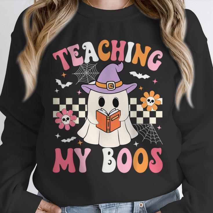 Groovy Teaching My Boos Teacher Ghost Halloween Teacher Unisex Sweatshirt, novelty gifts, funny gifts