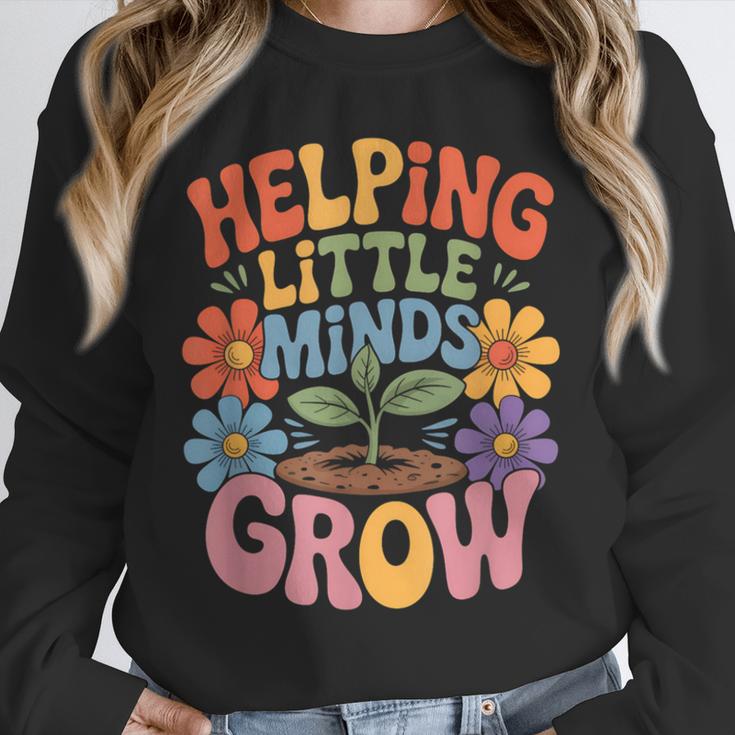 Helping Little Minds Grow Teacher First Day Back To School Unisex Sweatshirt, novelty gifts, funny gifts Helping Little Minds Grow Teacher First Day Back To School Unisex Sweatshirt, novelty gifts, funny gifts