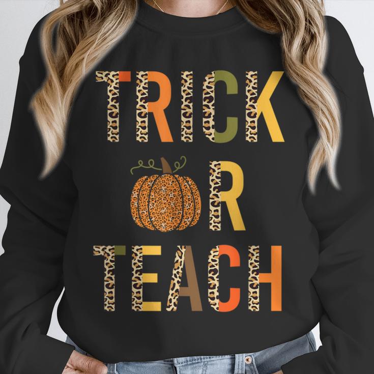 Leopard Trick Or Teach Halloween Teacher Costume Women Unisex Sweatshirt, novelty gifts, funny gifts Leopard Trick Or Teach Halloween Teacher Costume Women Unisex Sweatshirt, novelty gifts, funny gifts