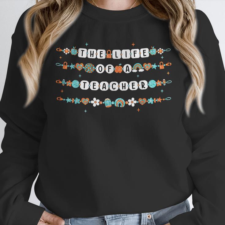 The Life Of A Teacher Friendship Bracelets Elementary School Unisex Sweatshirt, novelty gifts, funny gifts The Life Of A Teacher Friendship Bracelets Elementary School Unisex Sweatshirt, novelty gifts, funny gifts