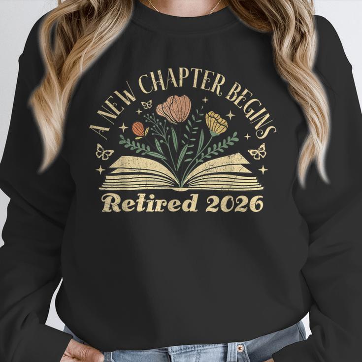 A New Chapter Begins Retired 2026 Teacher Retirement Unisex Sweatshirt, novelty gifts, funny gifts A New Chapter Begins Retired 2026 Teacher Retirement Unisex Sweatshirt, novelty gifts, funny gifts
