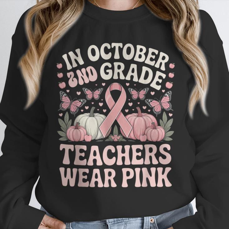 In October 2nd Grade Teachers Wear Pink Ribbon Breast Cancer Unisex Sweatshirt, novelty gifts, funny gifts