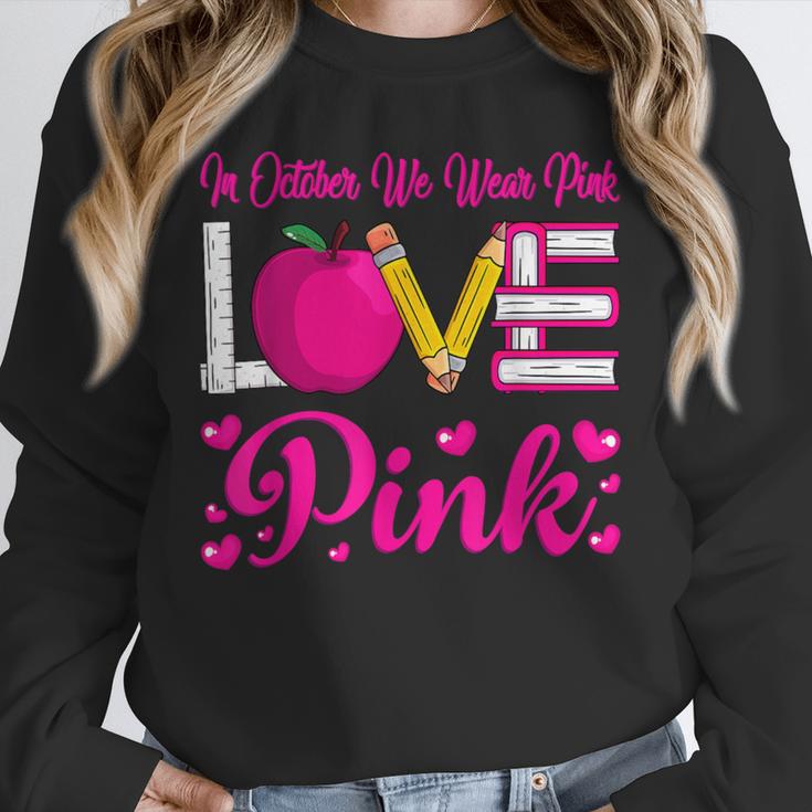 In October We Wear Pink Love Teacher Breast Cancer Awareness Unisex Sweatshirt, novelty gifts, funny gifts In October We Wear Pink Love Teacher Breast Cancer Awareness Unisex Sweatshirt, novelty gifts, funny gifts
