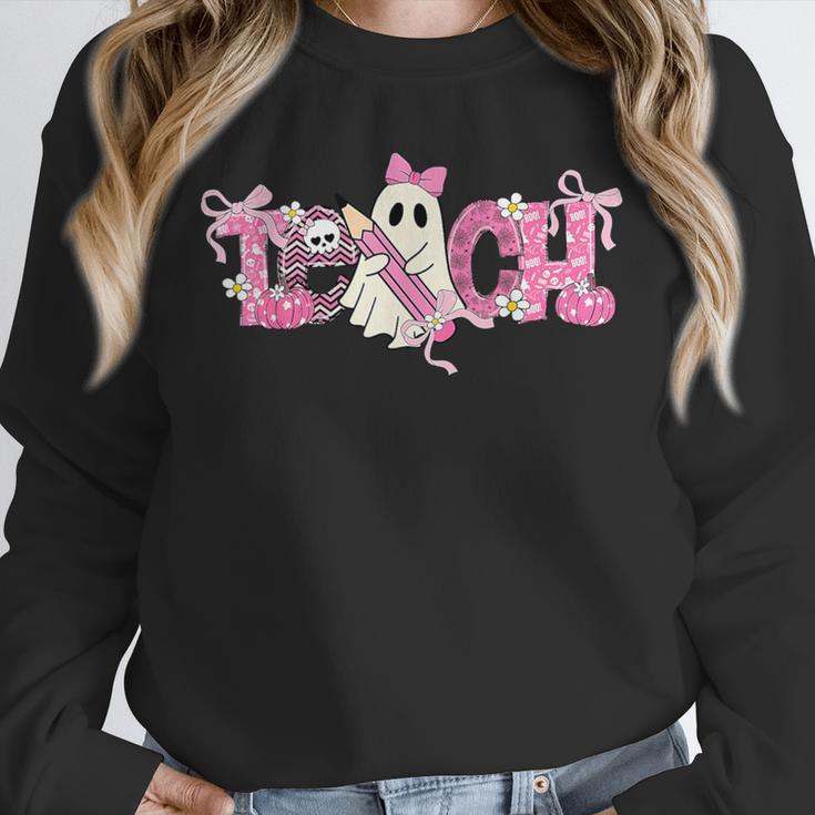 Pink Ghost Teach Halloween Teacher In Spooky Season Unisex Sweatshirt, novelty gifts, funny gifts Pink Ghost Teach Halloween Teacher In Spooky Season Unisex Sweatshirt, novelty gifts, funny gifts