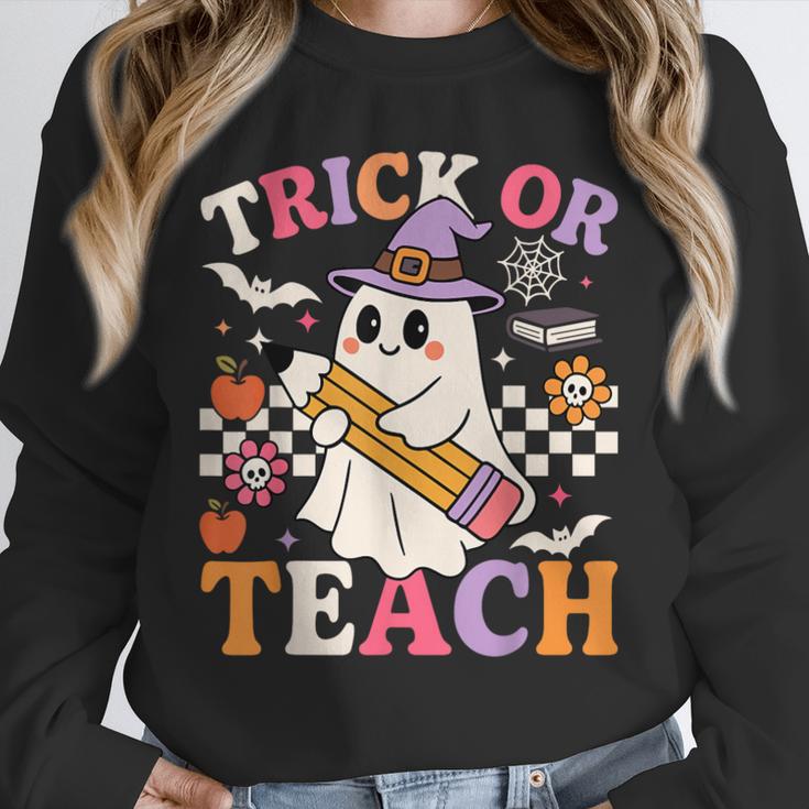 Retro Floral Ghost Trick Or Teach Groovy Teacher Halloween Unisex Sweatshirt, novelty gifts, funny gifts
