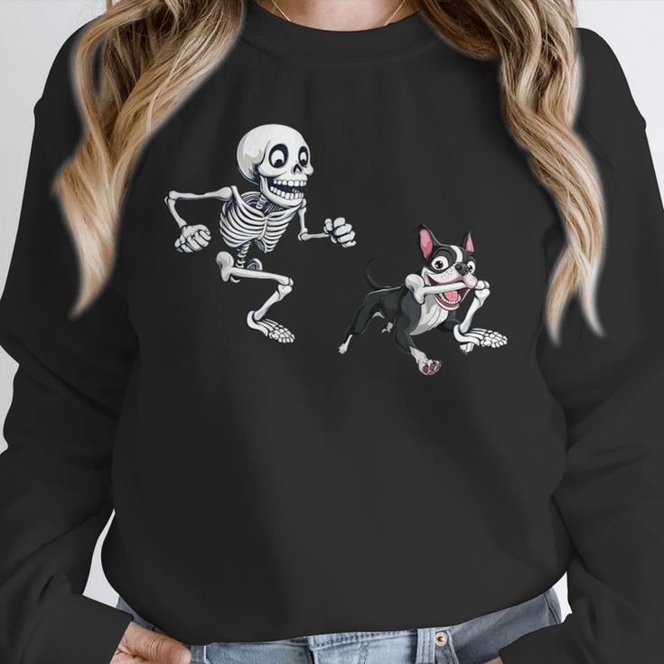 Skeleton Chasing Dog Boston Terrier Halloween Pet Lover Unisex Sweatshirt, novelty gifts, funny gifts