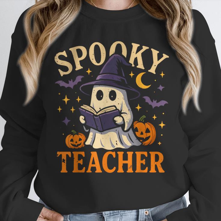 Spooky Teacher Halloween Cute Ghost Pumpkin Reading Women Unisex Sweatshirt, novelty gifts, funny gifts Spooky Teacher Halloween Cute Ghost Pumpkin Reading Women Unisex Sweatshirt, novelty gifts, funny gifts