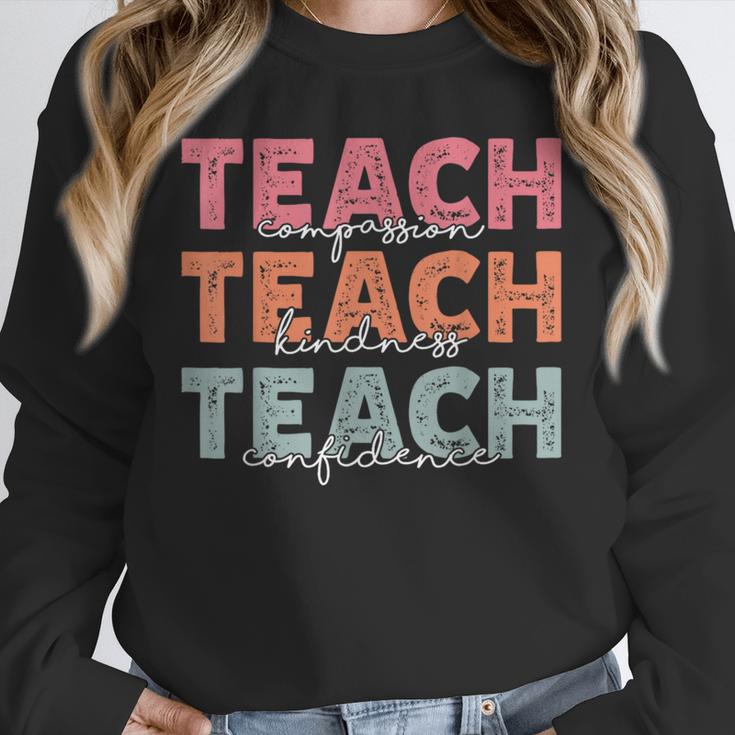 Teach Compassion Kindness Confidence For Teacher Unisex Sweatshirt, novelty gifts, funny gifts Teach Compassion Kindness Confidence For Teacher Unisex Sweatshirt, novelty gifts, funny gifts