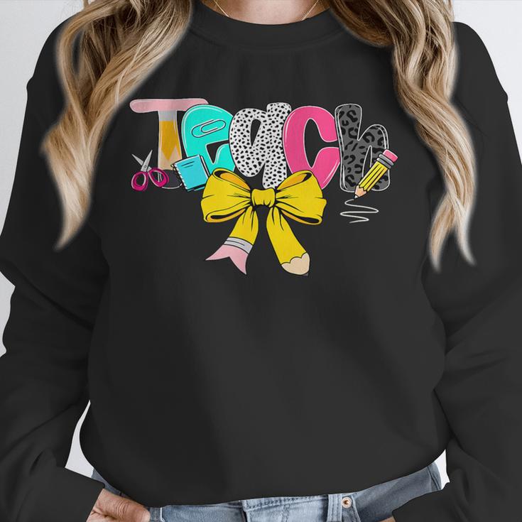 Teach Coquette Bow Teacher Back To School Happy First Day Unisex Sweatshirt, novelty gifts, funny gifts Teach Coquette Bow Teacher Back To School Happy First Day Unisex Sweatshirt, novelty gifts, funny gifts