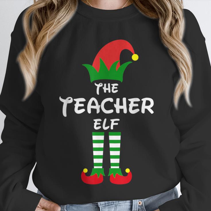 The Teacher Elf Family Matching Group Idea Christmas Unisex Sweatshirt, novelty gifts, funny gifts The Teacher Elf Family Matching Group Idea Christmas Unisex Sweatshirt, novelty gifts, funny gifts