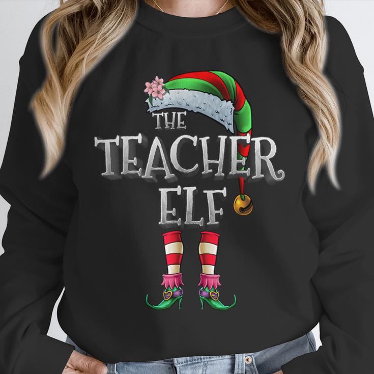The Teacher Elf Shirt Matching Family Christmas Elf Men Women Kids Unisex Sweatshirt, novelty gifts, funny gifts The Teacher Elf Shirt Matching Family Christmas Elf Men Women Kids Unisex Sweatshirt, novelty gifts, funny gifts