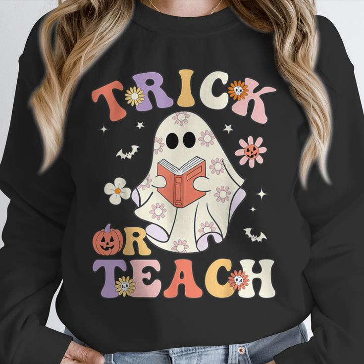 Teacher Halloween Trick Or Teach Floral Ghost Unisex Sweatshirt, novelty gifts, funny gifts Teacher Halloween Trick Or Teach Floral Ghost Unisex Sweatshirt, novelty gifts, funny gifts
