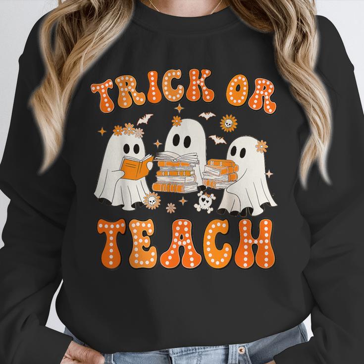 Teacher Halloween Trick Or Teach Retro Groovy Floral Ghost Unisex Sweatshirt, novelty gifts, funny gifts