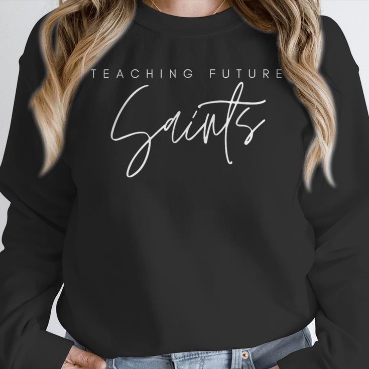 Teaching Future Saints Catholic Teacher Unisex Sweatshirt, novelty gifts, funny gifts Teaching Future Saints Catholic Teacher Unisex Sweatshirt, novelty gifts, funny gifts
