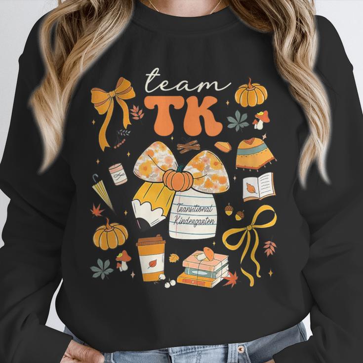 Team TK Crew Preppy Coquette Bow Pumpkin Fall TK Teacher Unisex Sweatshirt, novelty gifts, funny gifts Team TK Crew Preppy Coquette Bow Pumpkin Fall TK Teacher Unisex Sweatshirt, novelty gifts, funny gifts