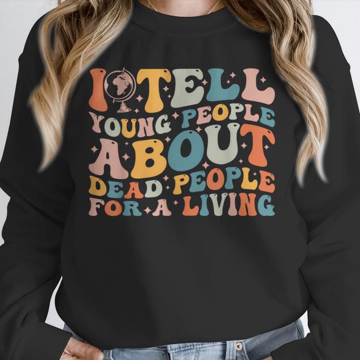 I Tell Young People About Dead People Groovy History Teacher Unisex Sweatshirt, novelty gifts, funny gifts