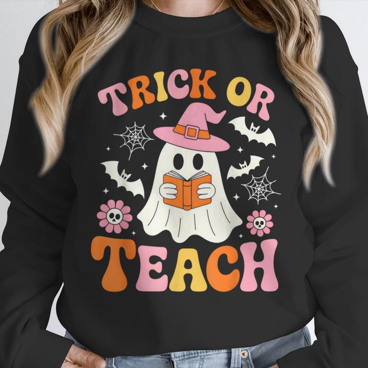 Trick Or Teach Cute Floral Ghost Teacher Halloween Costume Unisex Sweatshirt, novelty gifts, funny gifts