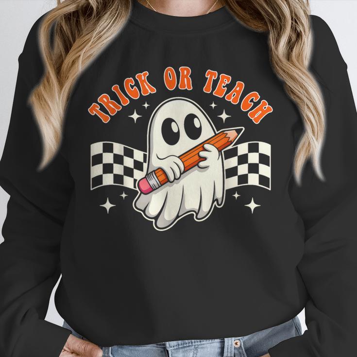 Trick Or Teach Groovy Retro Ghost Halloween Teacher Kids Unisex Sweatshirt, novelty gifts, funny gifts