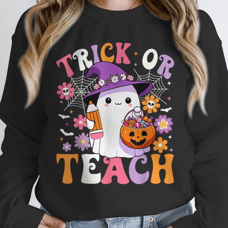 Trick Or Teach Groovy Teacher Ghost Halloween Teacher Unisex Sweatshirt, novelty gifts, funny gifts