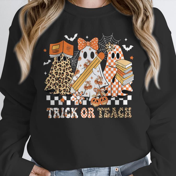 Trick Or Teach Groovy Teacher Halloween Floral Ghost Unisex Sweatshirt, novelty gifts, funny gifts