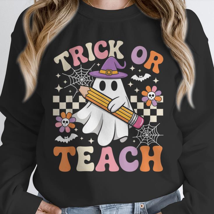 Trick Or Teach Groovy Teacher Halloween Retro Ghost Unisex Sweatshirt, novelty gifts, funny gifts Trick Or Teach Groovy Teacher Halloween Retro Ghost Unisex Sweatshirt, novelty gifts, funny gifts
