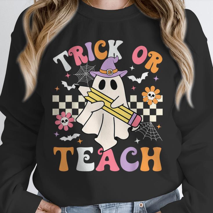 Trick Or Teach Groovy Teacher Halloween Retro Teacher Ghost Unisex Sweatshirt, novelty gifts, funny gifts