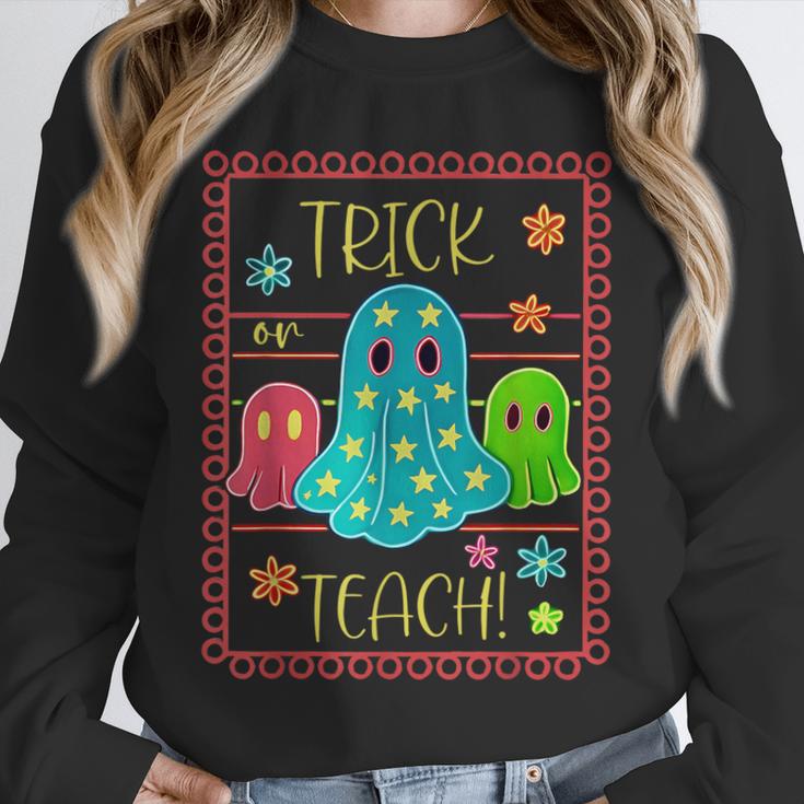 Trick Or Teach Neon Ghost Flower Teacher Spooky Halloween Unisex Sweatshirt, novelty gifts, funny gifts Trick Or Teach Neon Ghost Flower Teacher Spooky Halloween Unisex Sweatshirt, novelty gifts, funny gifts
