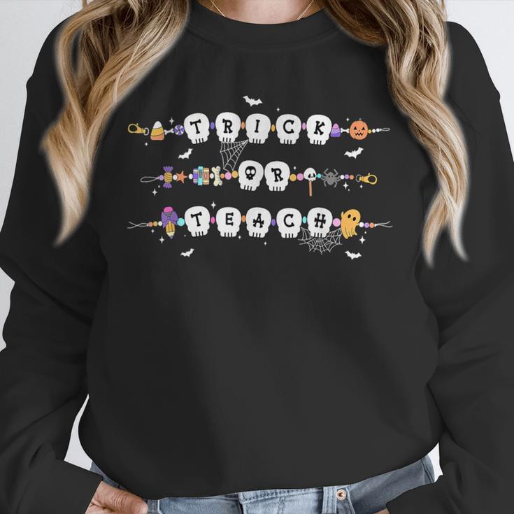 Trick Or Teach Spooky Teacher Happy Halloween Bracelet Unisex Sweatshirt, novelty gifts, funny gifts Trick Or Teach Spooky Teacher Happy Halloween Bracelet Unisex Sweatshirt, novelty gifts, funny gifts