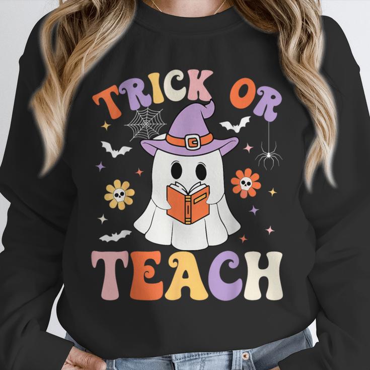 Trick Or Teach Teacher Groovy Ghost Halloween Teacher Unisex Sweatshirt, novelty gifts, funny gifts Trick Or Teach Teacher Groovy Ghost Halloween Teacher Unisex Sweatshirt, novelty gifts, funny gifts