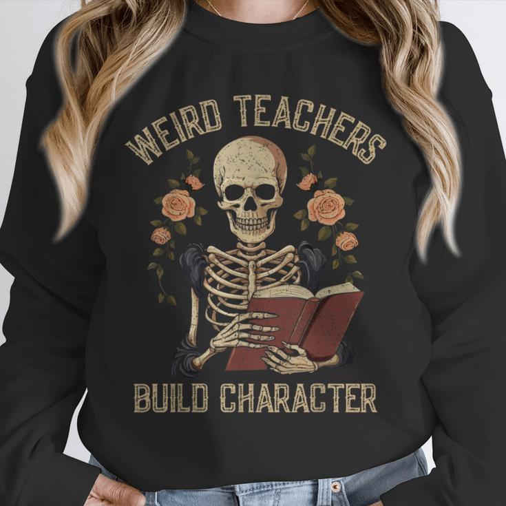 Weird Teachers Build Character Skeleton Book Halloween Women Unisex Sweatshirt, novelty gifts, funny gifts Weird Teachers Build Character Skeleton Book Halloween Women Unisex Sweatshirt, novelty gifts, funny gifts
