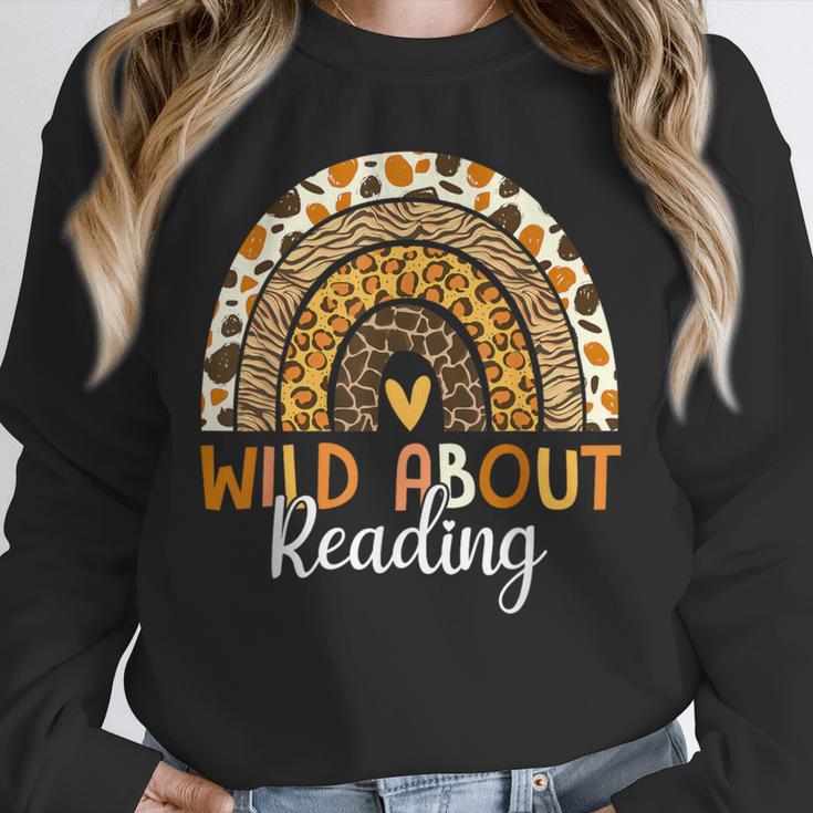 Wild About Reading Teacher Back To School Leopard Rainbow Unisex Sweatshirt, novelty gifts, funny gifts