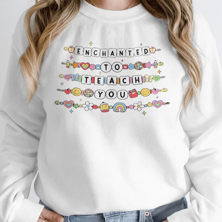 Enchanted To Teach You Friendship Bracelet Teacher Girl Kids Unisex Sweatshirt, novelty gifts, funny gifts Enchanted To Teach You Friendship Bracelet Teacher Girl Kids Unisex Sweatshirt, novelty gifts, funny gifts