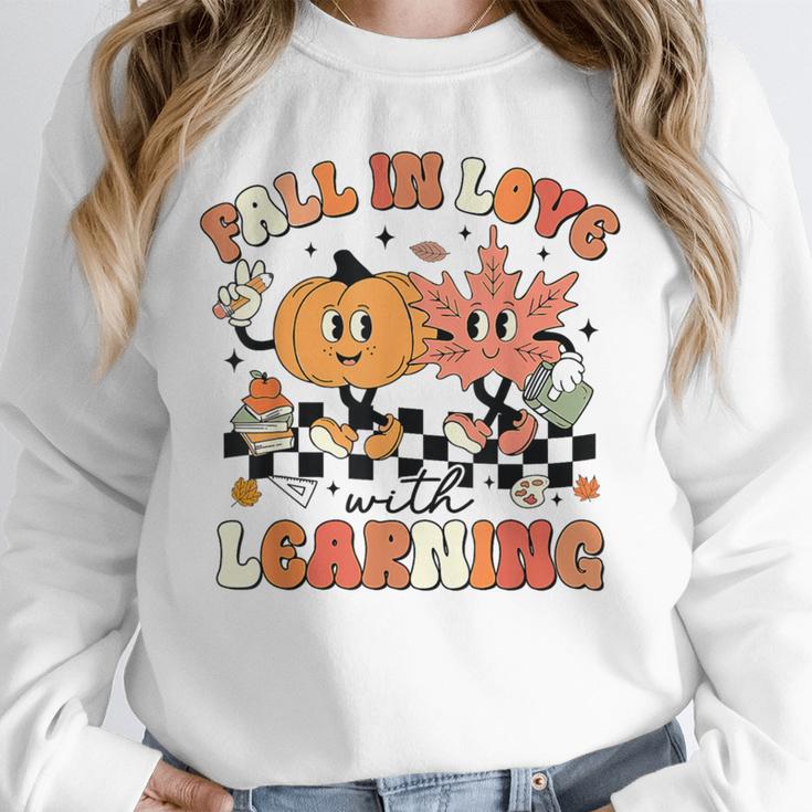 Fall In Love With Learning Teacher Retro Thanksgiving Unisex Sweatshirt, novelty gifts, funny gifts Fall In Love With Learning Teacher Retro Thanksgiving Unisex Sweatshirt, novelty gifts, funny gifts