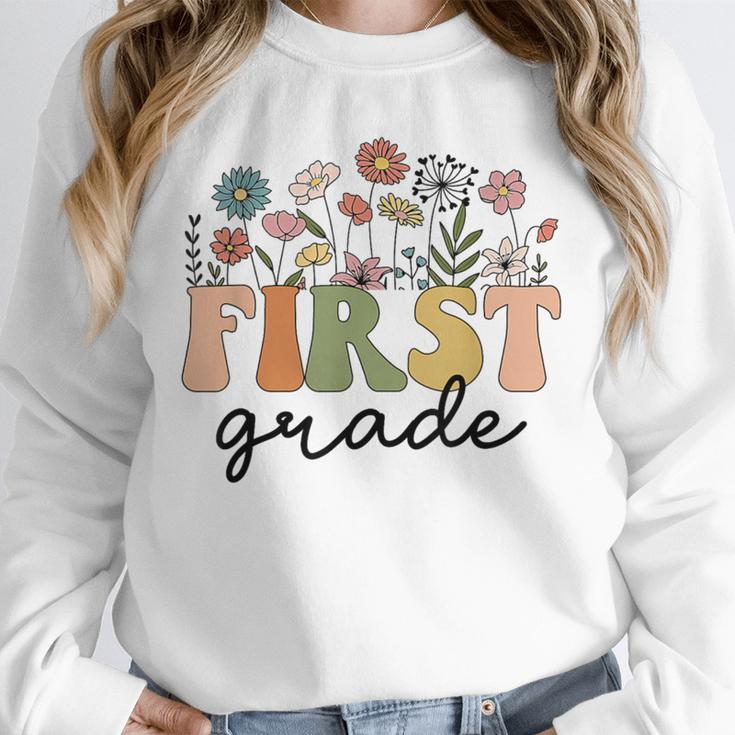 First Grade Teacher Wildflower Back To School Floral Outfits Unisex Sweatshirt, novelty gifts, funny gifts First Grade Teacher Wildflower Back To School Floral Outfits Unisex Sweatshirt, novelty gifts, funny gifts