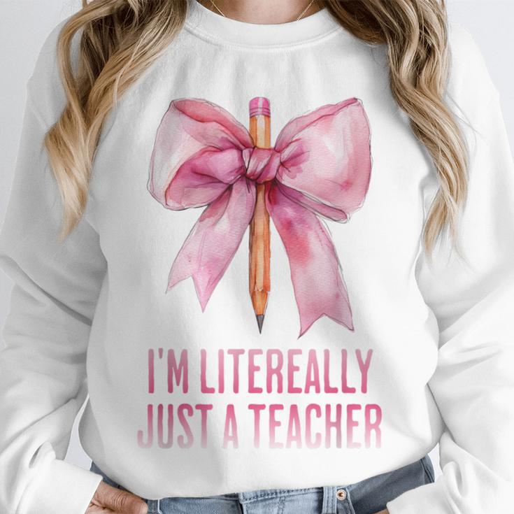 I'm Literally Just a Teacher Pencil Coquette Bow School Unisex Sweatshirt, novelty gifts, funny gifts I'm Literally Just a Teacher Pencil Coquette Bow School Unisex Sweatshirt, novelty gifts, funny gifts