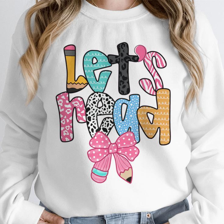 Lets Read Reading Teacher Back To School Literacy Pencil Bow Unisex Sweatshirt, novelty gifts, funny gifts Lets Read Reading Teacher Back To School Literacy Pencil Bow Unisex Sweatshirt, novelty gifts, funny gifts