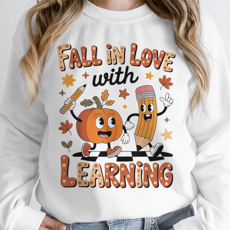 Retro Fall In Love With Learning Autumn Pumpkin Teacher Kids Unisex Sweatshirt, novelty gifts, funny gifts Retro Fall In Love With Learning Autumn Pumpkin Teacher Kids Unisex Sweatshirt, novelty gifts, funny gifts