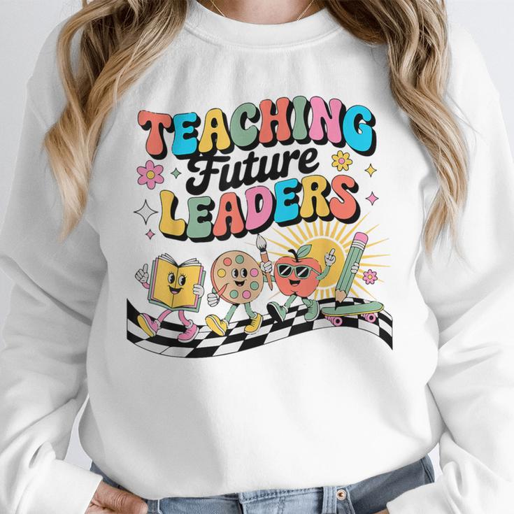 Retro Teaching Future Leaders Groovy Teacher Back To School Unisex Sweatshirt, novelty gifts, funny gifts Retro Teaching Future Leaders Groovy Teacher Back To School Unisex Sweatshirt, novelty gifts, funny gifts
