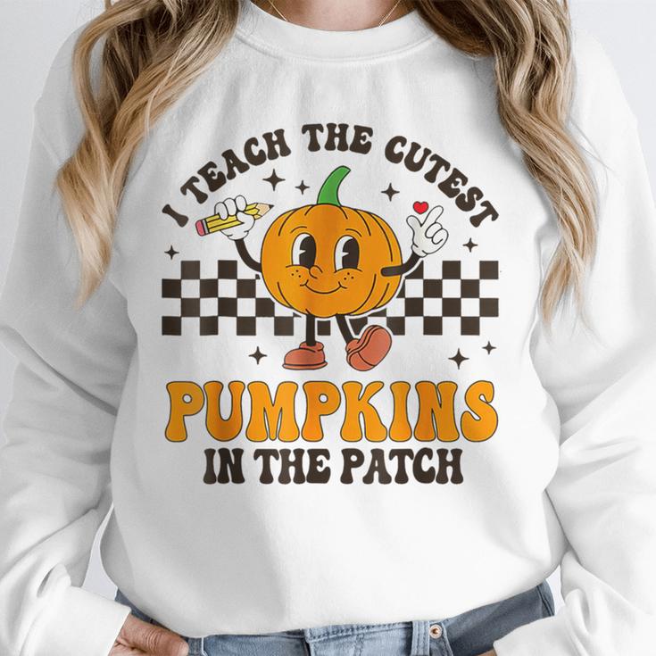 I Teach The Cutest Pumpkins In The Patch Groovy Teacher Fall Unisex Sweatshirt, novelty gifts, funny gifts